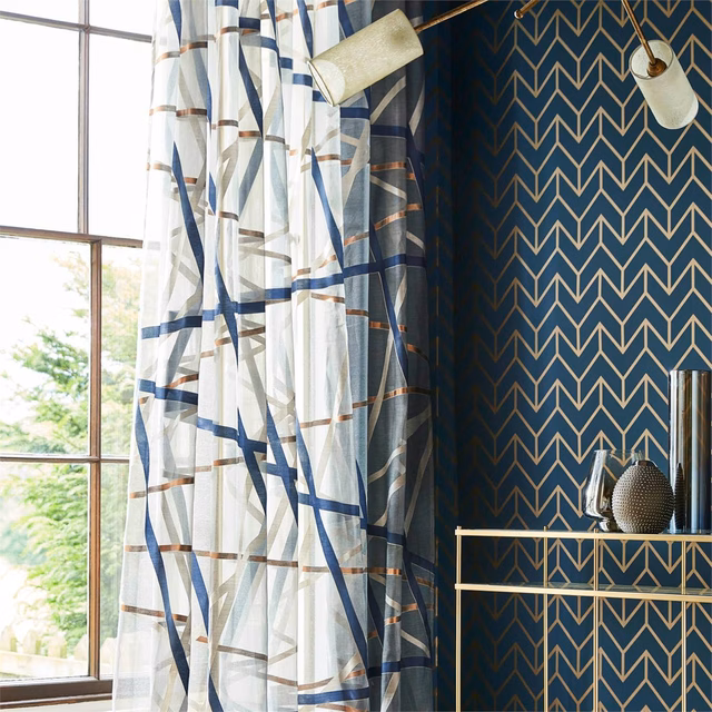 Ivory sheer with sweeping ink navy bands, copper lines and taupe crossings
