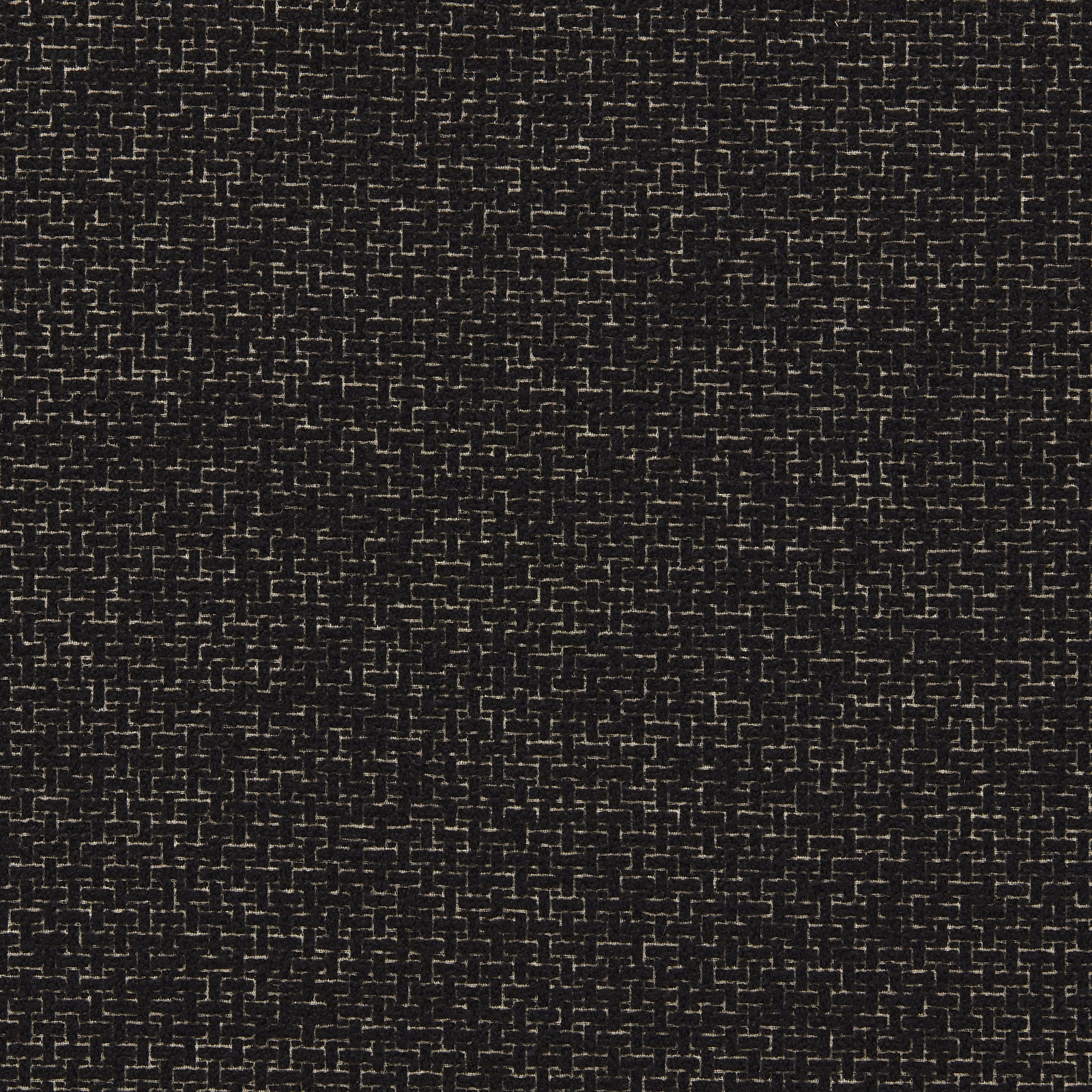 Black boucle ground with tightly broken chalk flecks and nubby texture
