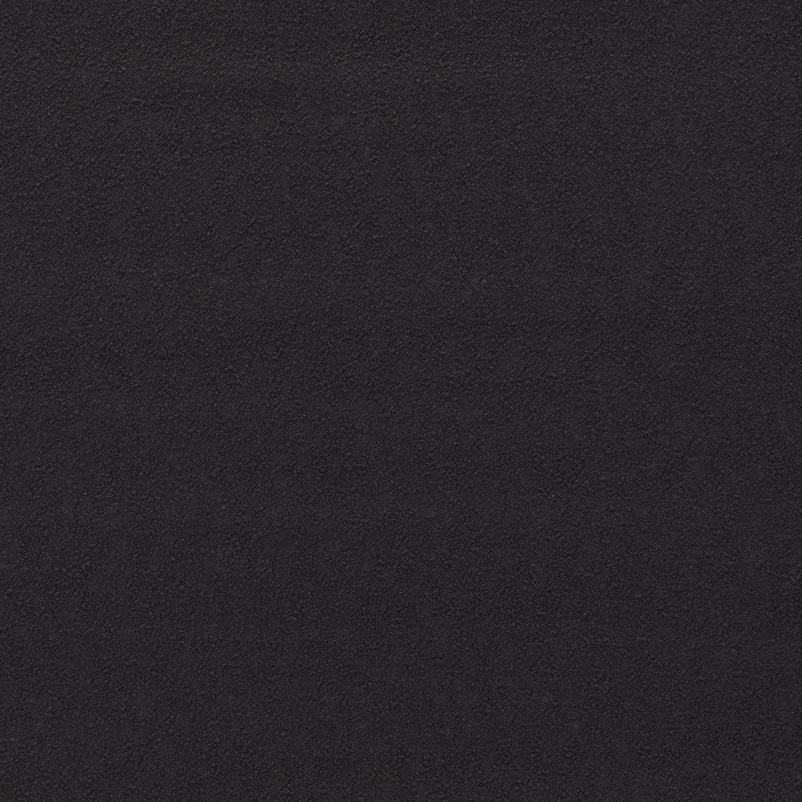 Close-up of charcoal-black boucle upholstery fabric with a dense, softly napped texture