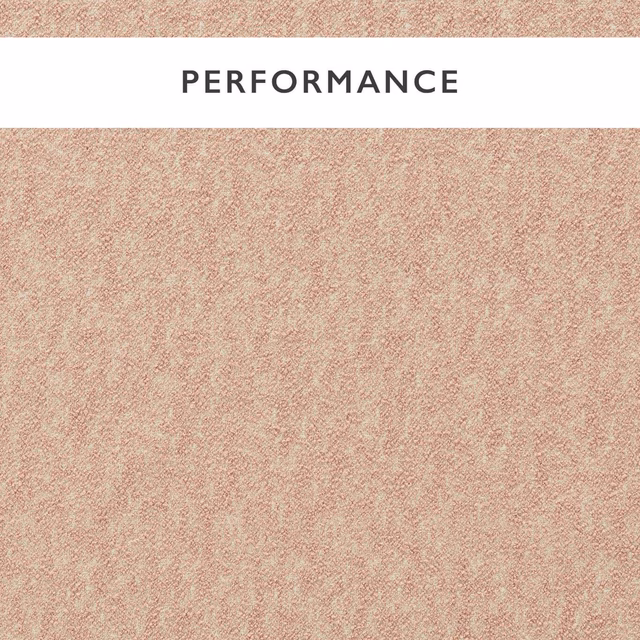 Close-up of softly mottled dusty blush-pink boucle upholstery fabric with nubby texture