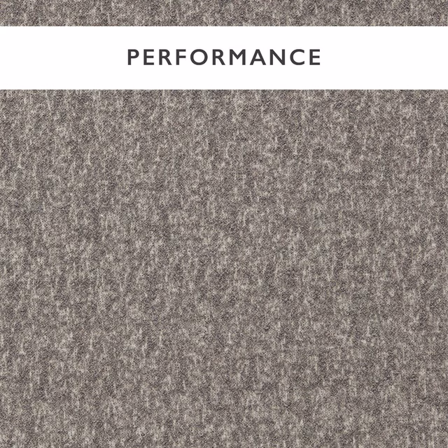 Close-up of cool slate-grey boucle with charcoal flecks and a nubby woven texture