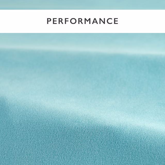 Close-up of soft aqua teal velvet showing fine pile and broad directional sheen