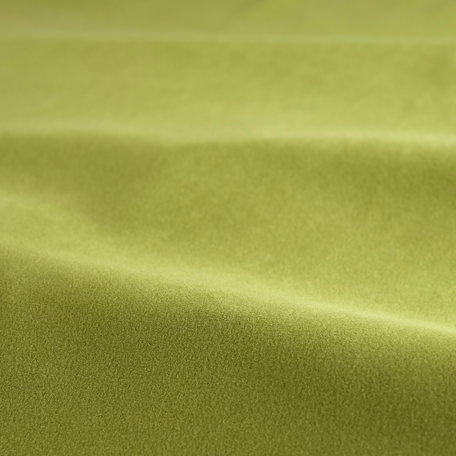 Avocado green velvet swatch showing dense short pile and soft directional sheen