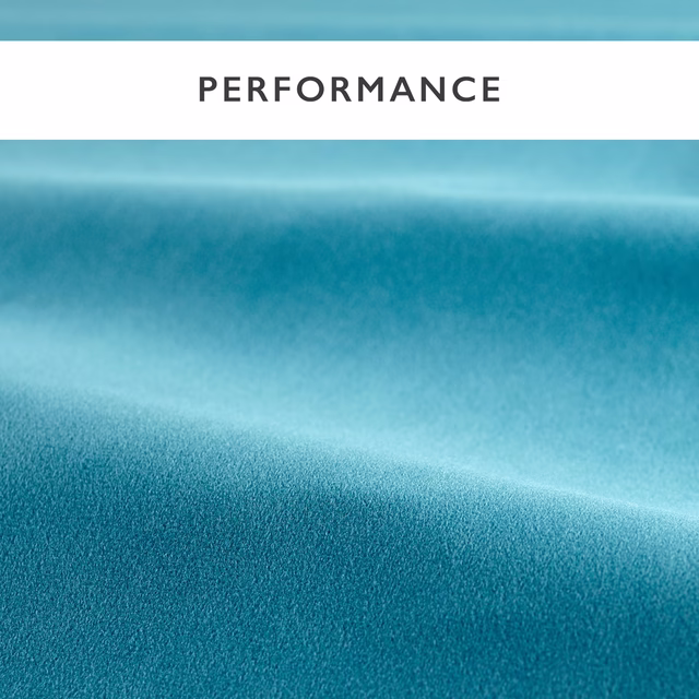 Close view of cool teal-blue velvet with smooth pile and soft reflective bands