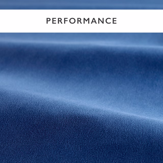 Deep azure-blue velvet showing soft pile and luminous highlights across folded fabric