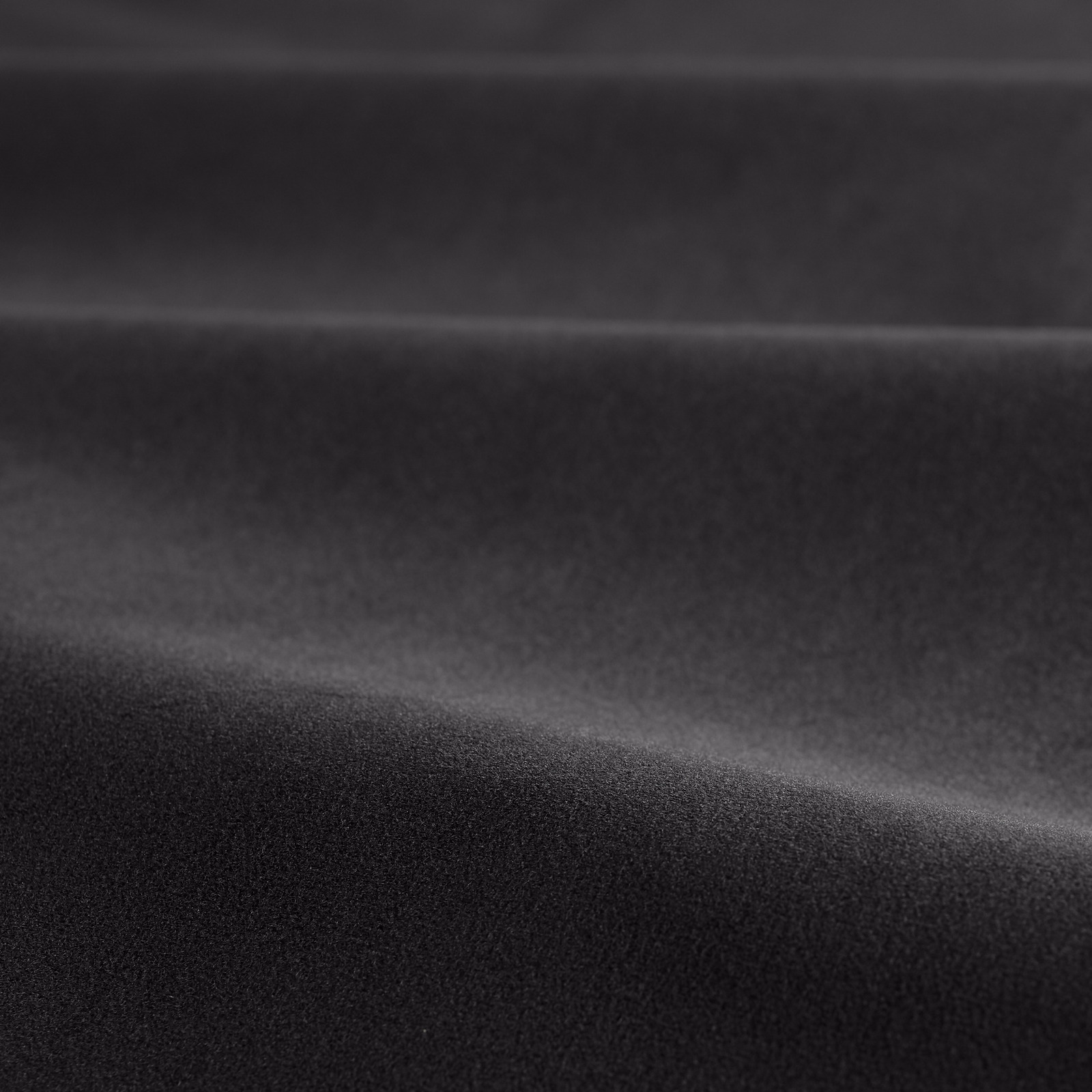 Deep black velvet swatch with horizontal folds and a soft silvery sheen