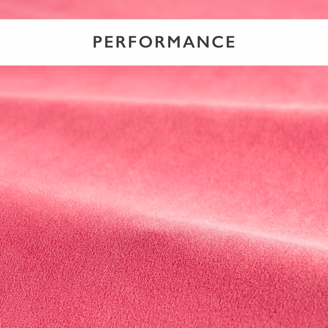 Rosy coral pink velvet showing smooth pile and shifting highlights across folded swatch