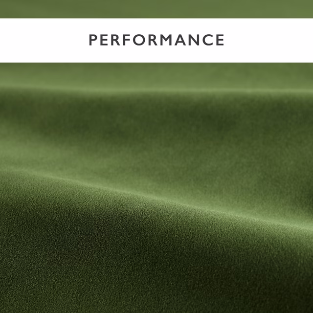 Deep forest green velvet with directional sheen and a softly brushed pile