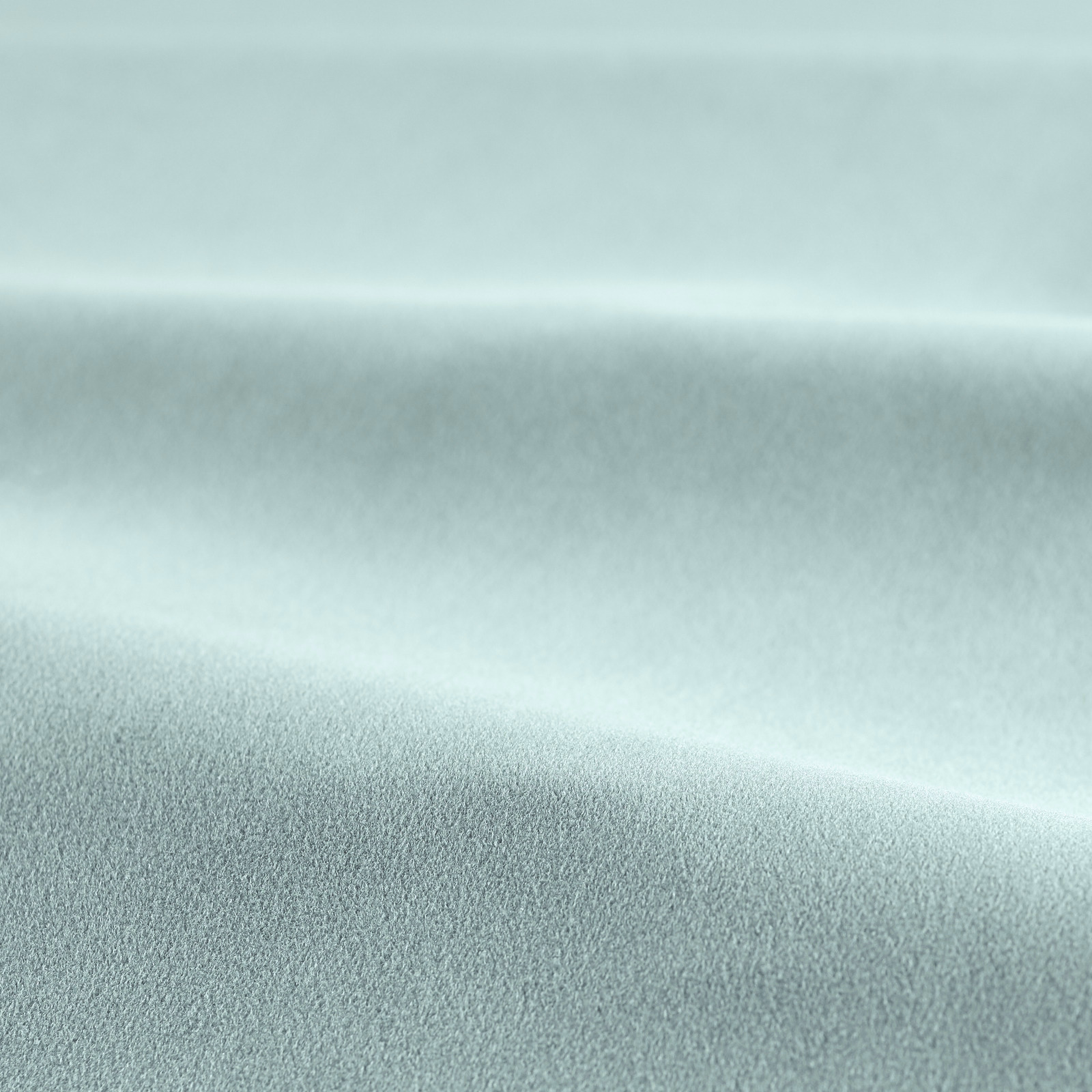 Icy blue-grey velvet pile catching light across a softly folded swatch