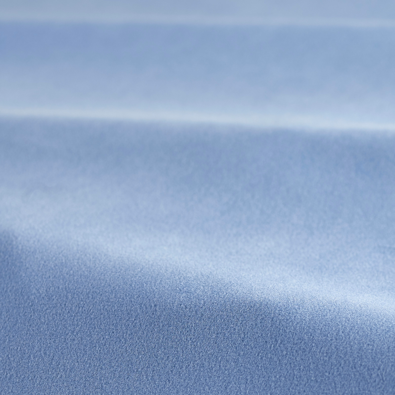 Close-up of solid hydrangea-blue velvet showing soft pile and shifting sheen