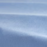 Close-up of solid hydrangea-blue velvet showing soft pile and shifting sheen