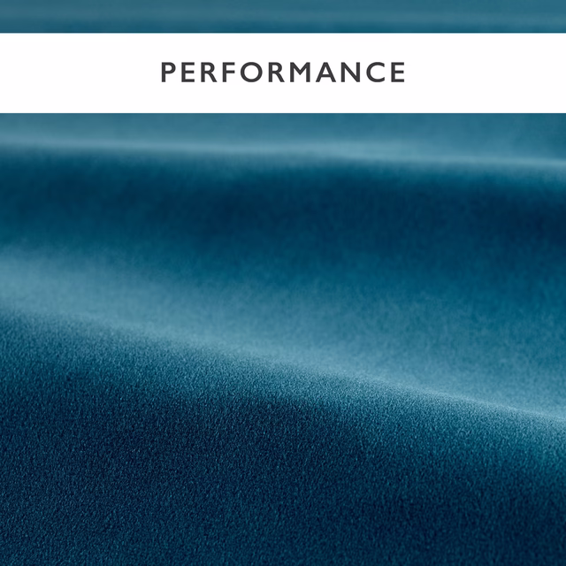 Deep indigo-blue velvet pile with soft highlights across folded fabric