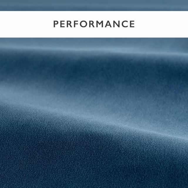 Deep ink-blue velvet with plush pile and pale blue highlights across folded fabric