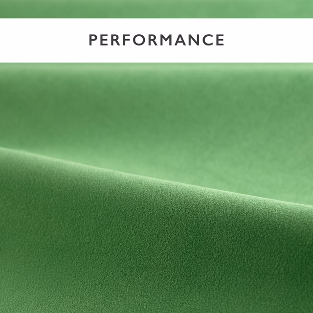 Deep jade green velvet swatch showing a soft pile and directional tonal sheen