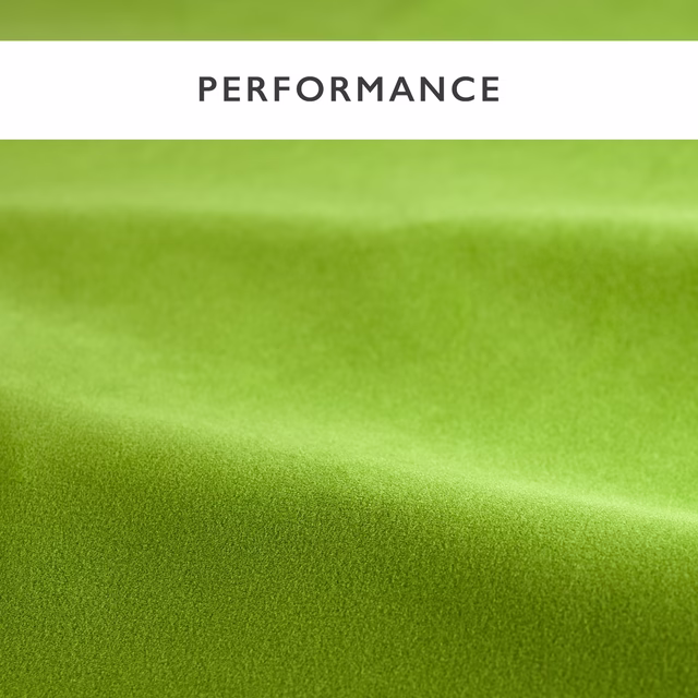 Bright kelp green velvet showing smooth pile and soft directional sheen