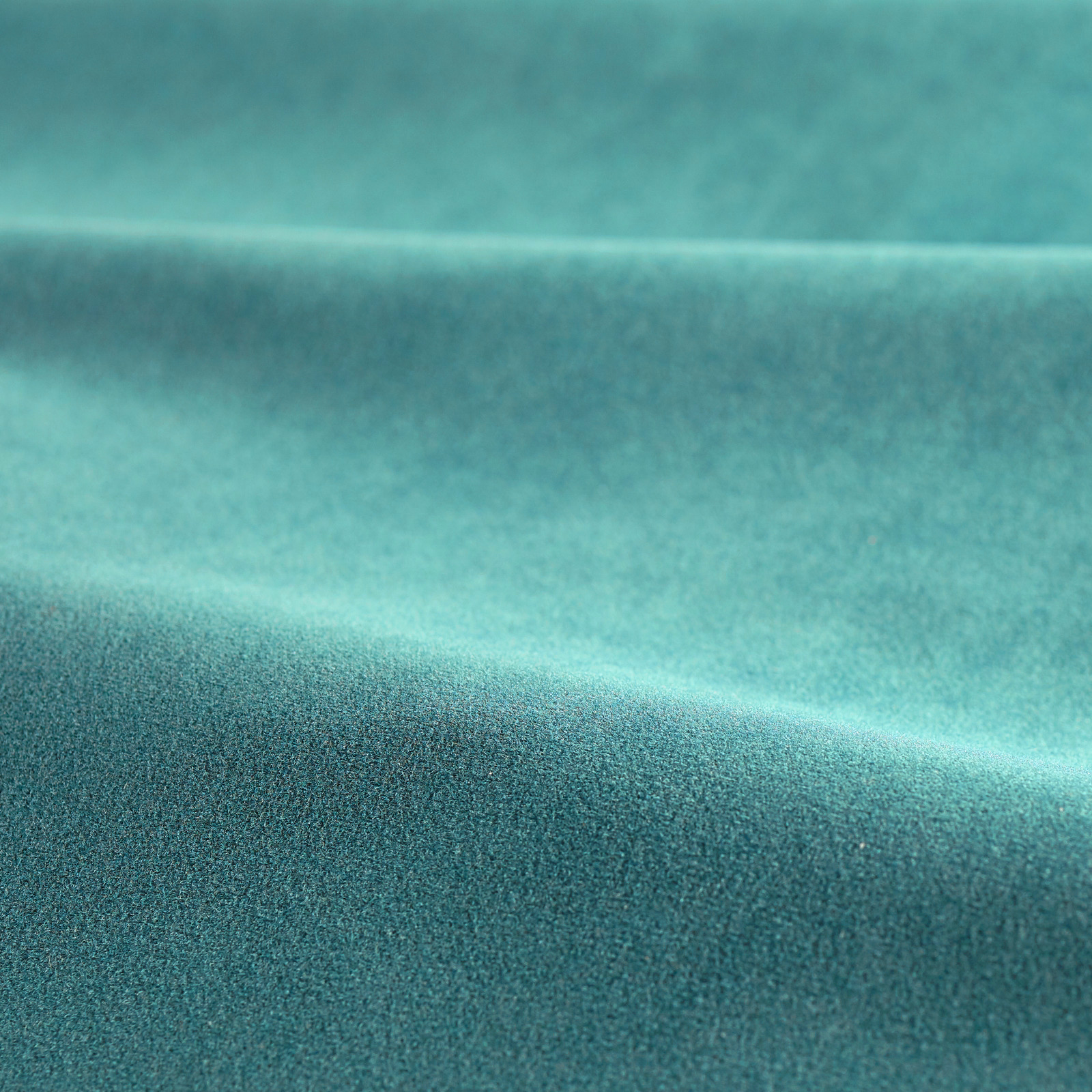 Lagoon teal velvet with plush pile folded into soft, light-catching ridges
