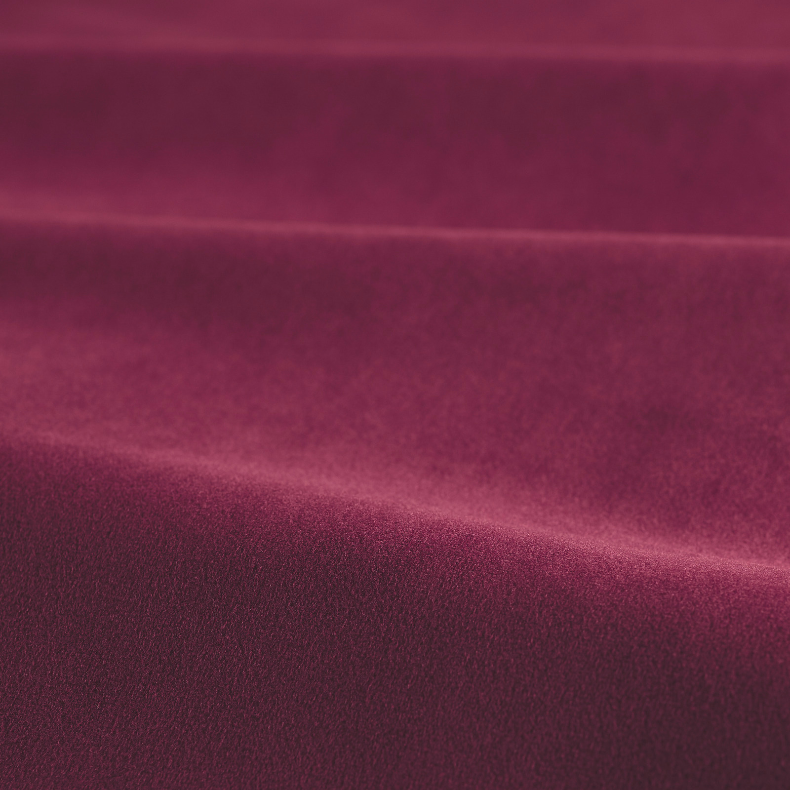 Deep magenta velvet with plush nap and directional light-catching shading