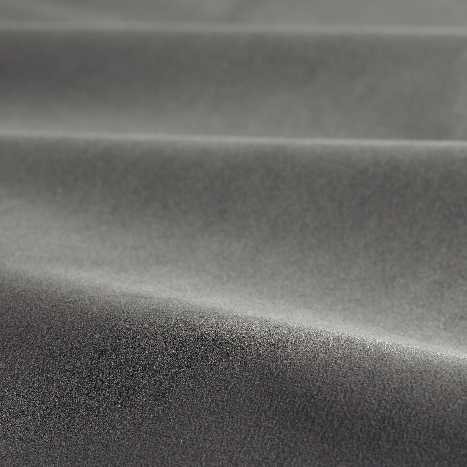 Folded mole-grey velvet showing charcoal shadows and silver nap highlights