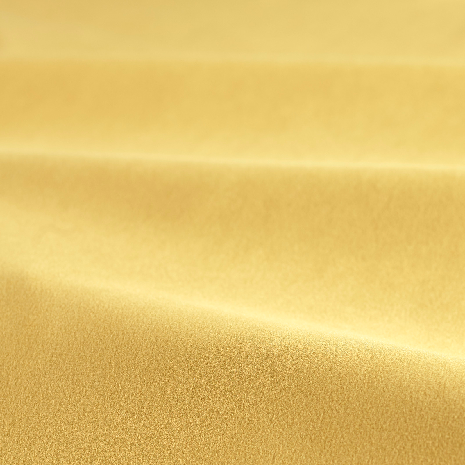 Warm golden-yellow velvet swatch showing plush pile and softly shaded horizontal folds