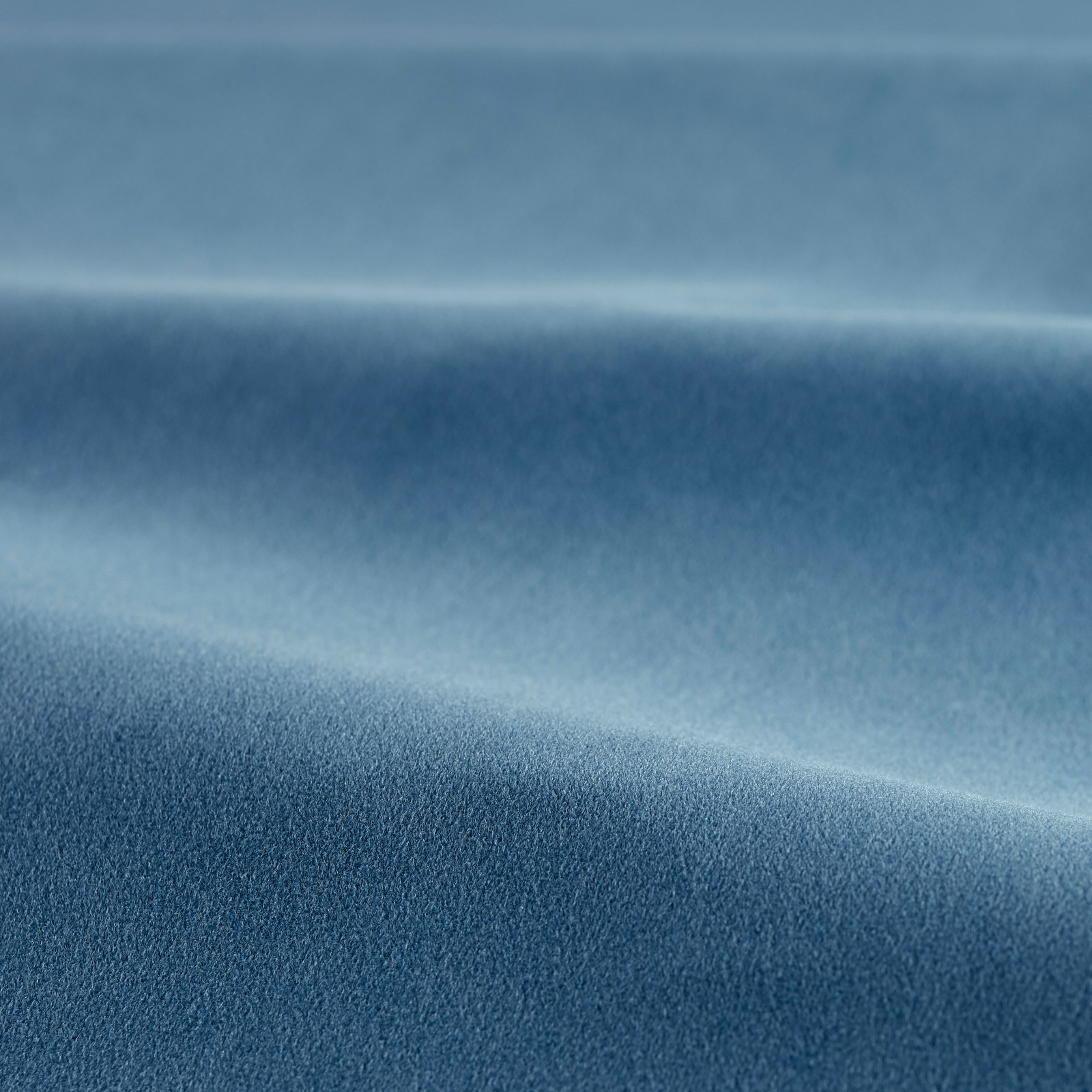Deep ocean-blue velvet swatch showing soft pile and subtle directional tonal sheen