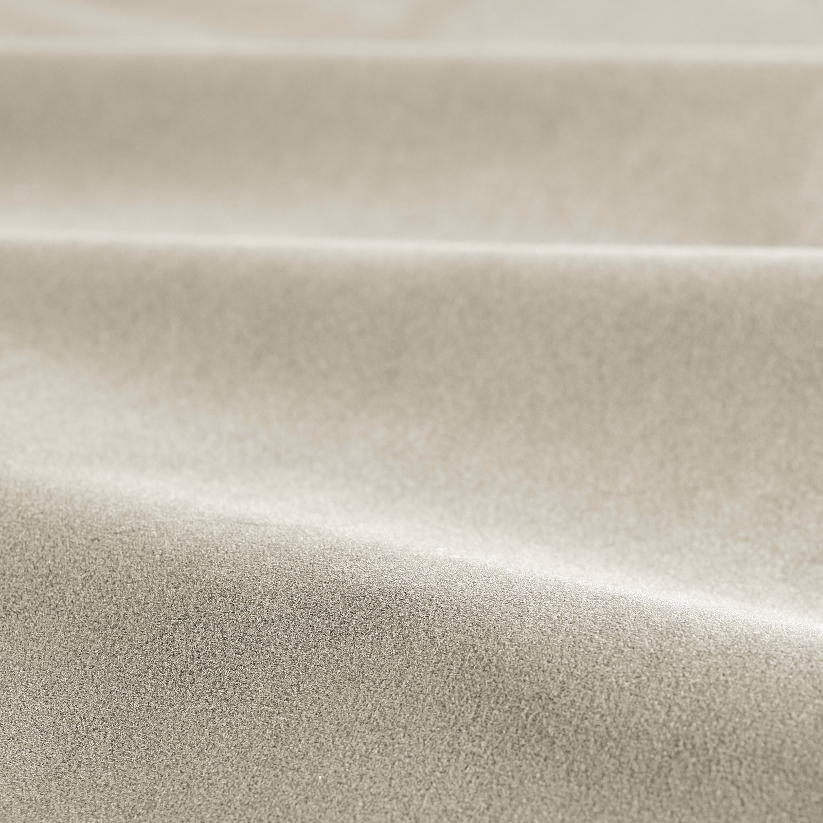 Close-up of pale oyster taupe velvet with a softly brushed, light-catching pile