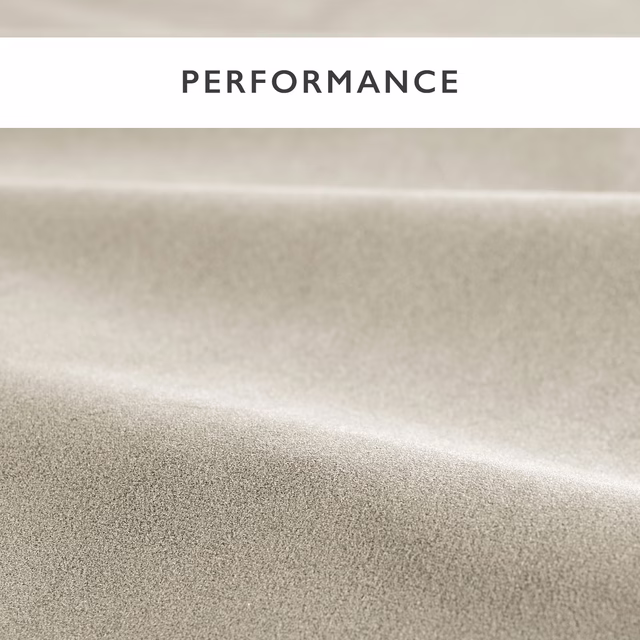 Close-up of pale oyster taupe velvet with a softly brushed, light-catching pile