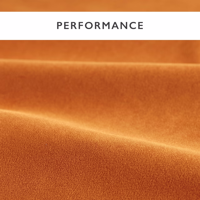 Warm paprika-orange velvet with soft copper highlights folding across a dense plain pile