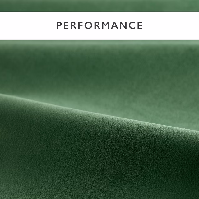 Deep pine green velvet with smooth pile and softly highlighted folded surface