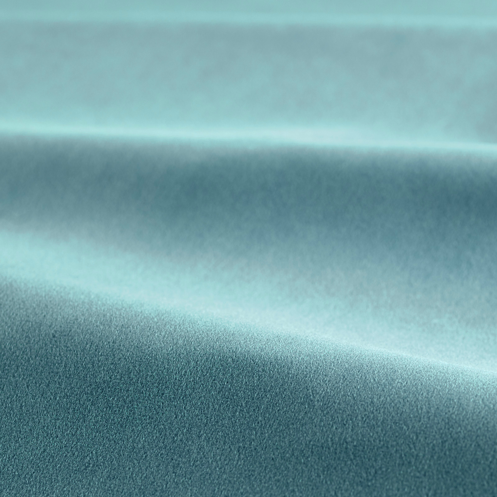 Close-up of Seaglass teal velvet showing smooth pile and softly shaded folds