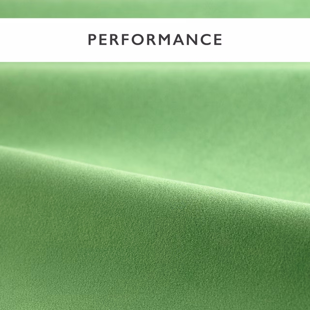 Soft pea-green velvet showing a smooth nap and gentle directional sheen