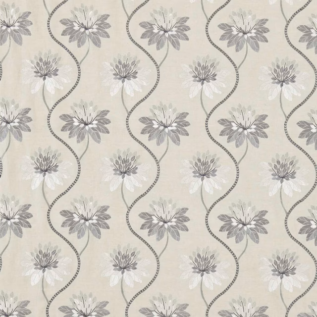 Cream fabric with dusty blue-grey flowers and curling dotted vines