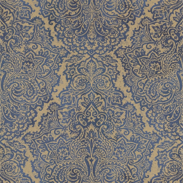 Sapphire blue damask scrolls over a muted taupe, lightly textured wallpaper ground