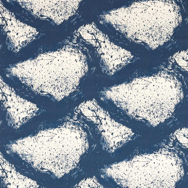 Ivory pebble-like forms edged by distressed ink-blue brushwork