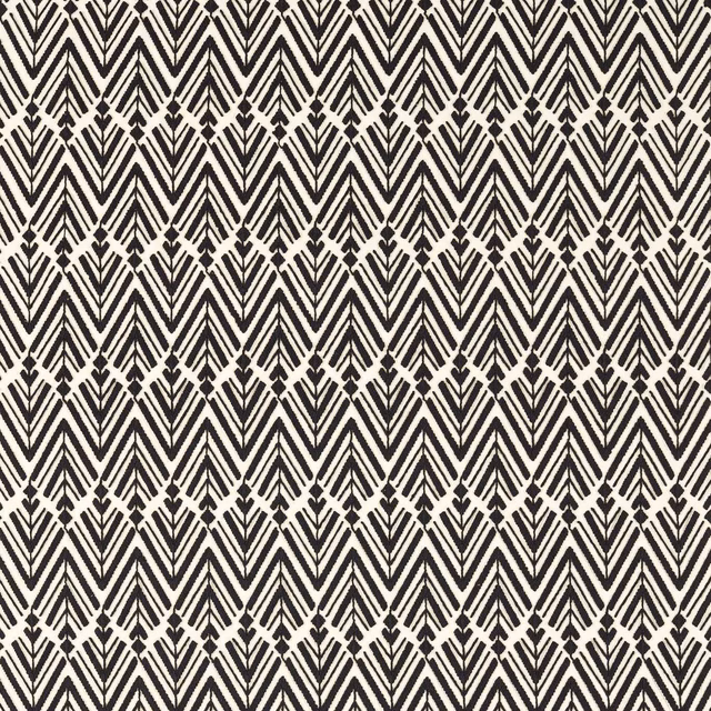 Black and ivory woven fabric with repeating chevrons and broken diamond accents