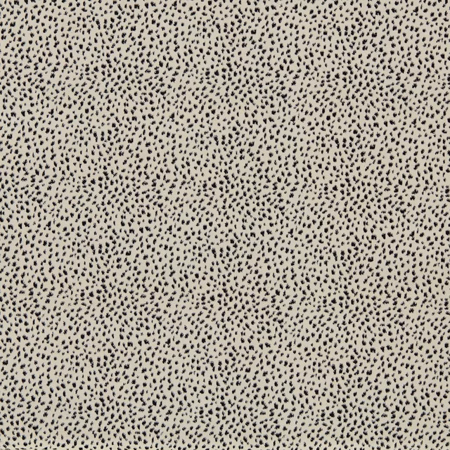 Warm fawn velvet with dense charcoal dalmatian spots and subtle pile depth