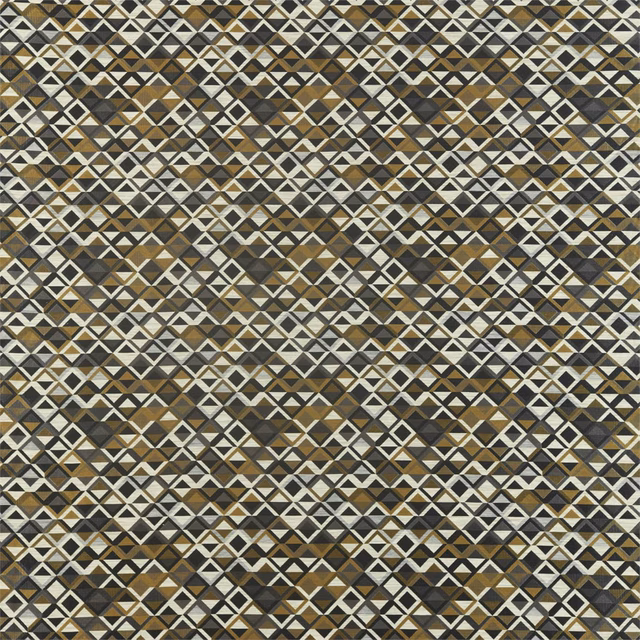 Slate and charcoal geometric diamonds with brass accents in a dense woven textile