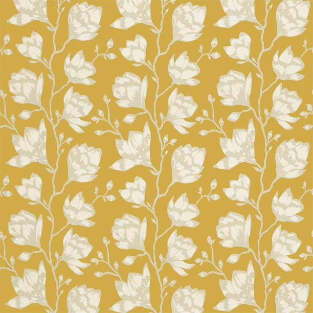 Saffron yellow fabric with repeating cream flowers, leaves and curling botanical stems