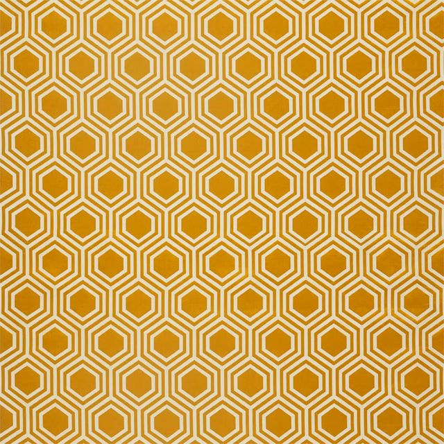Warm ochre-gold fabric with repeating ivory hexagonal outlines and a fine textile surface