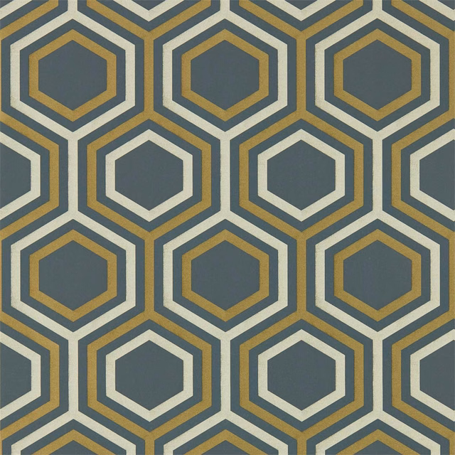 Slate-grey wallpaper with repeating hexagons, ivory outlines and ochre-gold bands