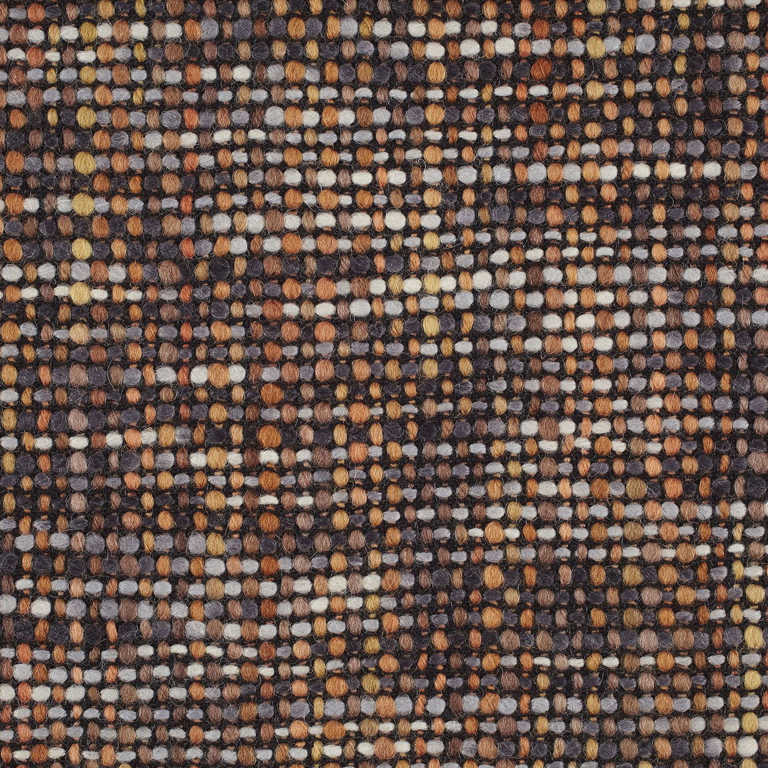 Close-up of Cestino Cinnamon’s chunky cinnamon, charcoal, cream and ochre woven texture