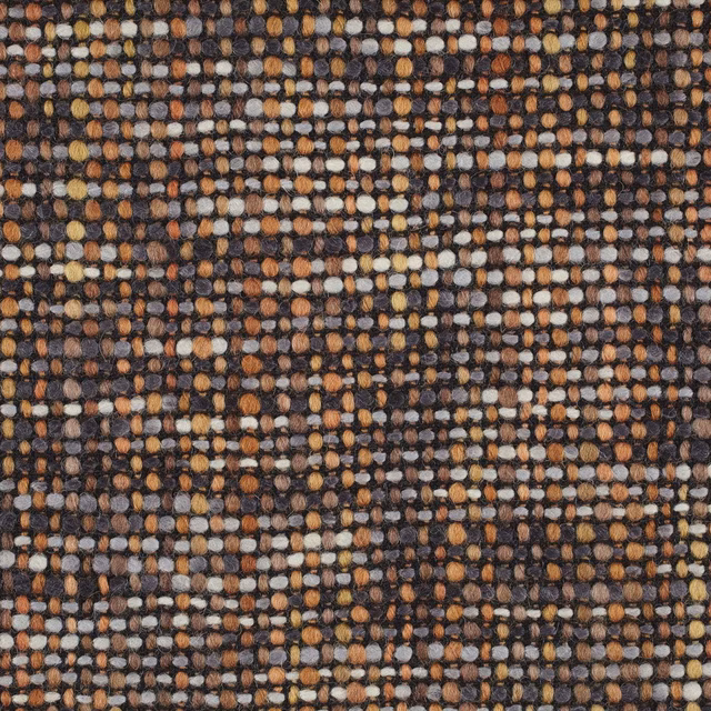 Close-up of Cestino Cinnamon’s chunky cinnamon, charcoal, cream and ochre woven texture