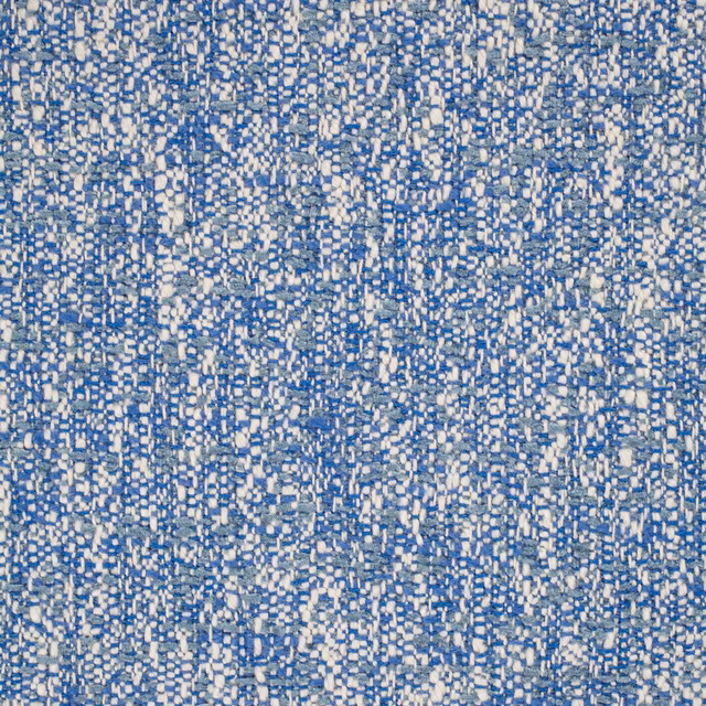Close-up of muted denim-blue fabric with dense ivory flecked woven texture