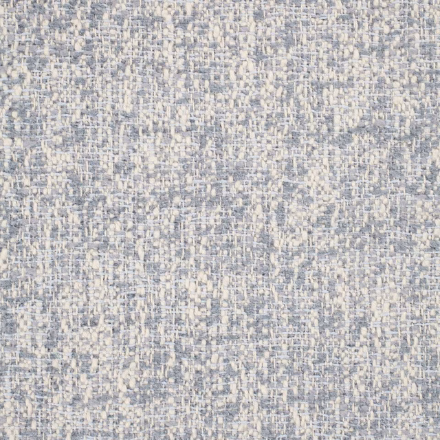Close-up of powder blue woven textile with ivory flecks and irregular slub texture