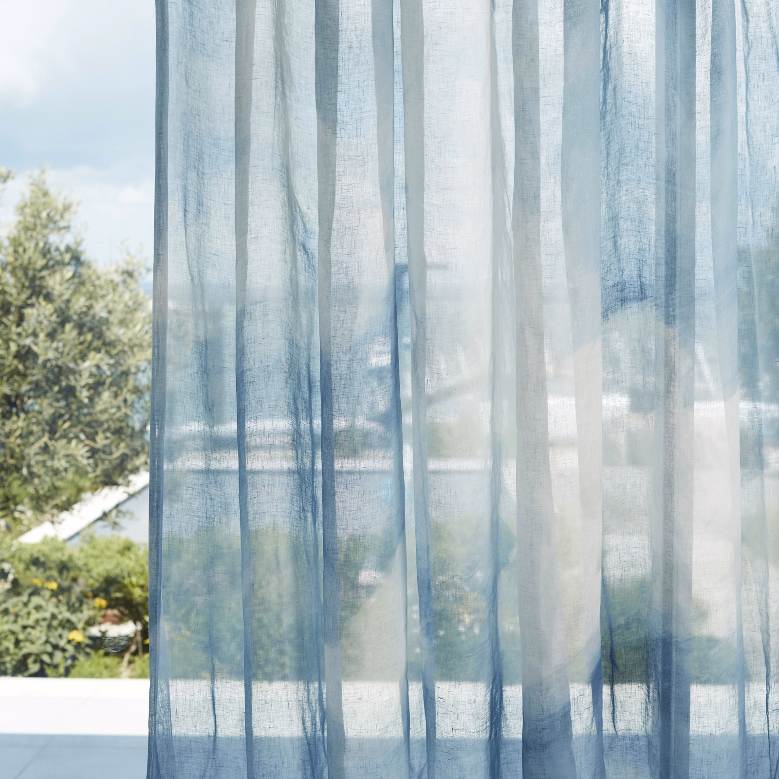 Translucent sky-blue sheer with vertical bands and a fine open weave