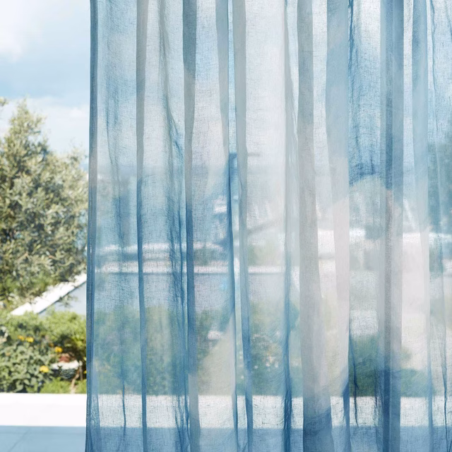 Translucent sky-blue sheer with vertical bands and a fine open weave