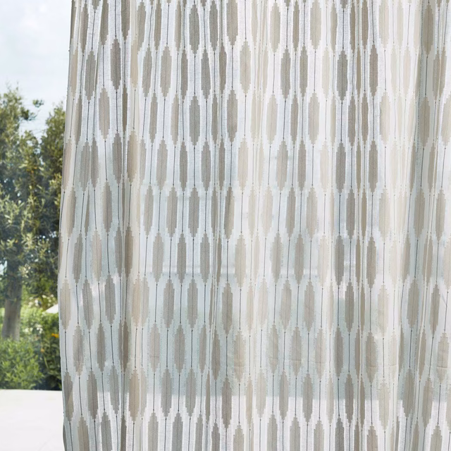 Chalk sheer curtain with pale grey-blue elongated geometric columns in daylight
