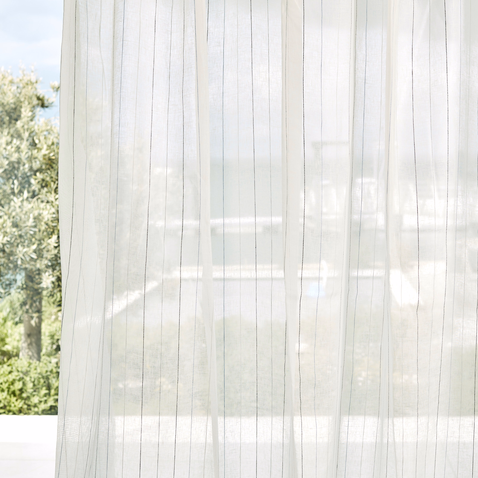Cool chalk-white sheer curtain with fine mist-grey vertical lines and soft transparency