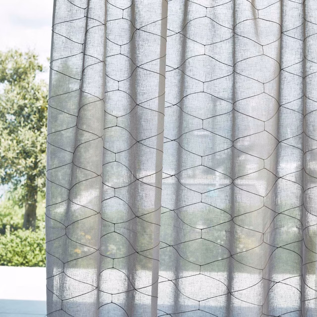 Cool grey sheer curtain with dark irregular hexagonal lines and linen-like texture