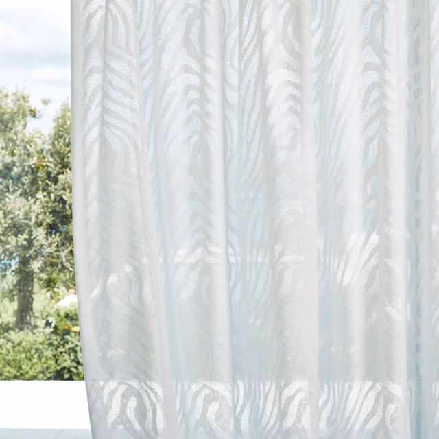 Cool chalk sheer with pale blue-grey flowing bands in curtain folds