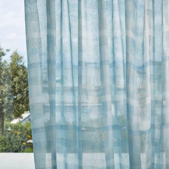 Pale icy-blue sheer with translucent geometric bands and softly textured weave